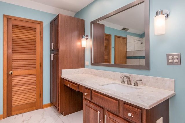 228 Cornell Ave, Des Plaines, IL 60016 - bathroom featuring vanity, marble look tiles, and a shower