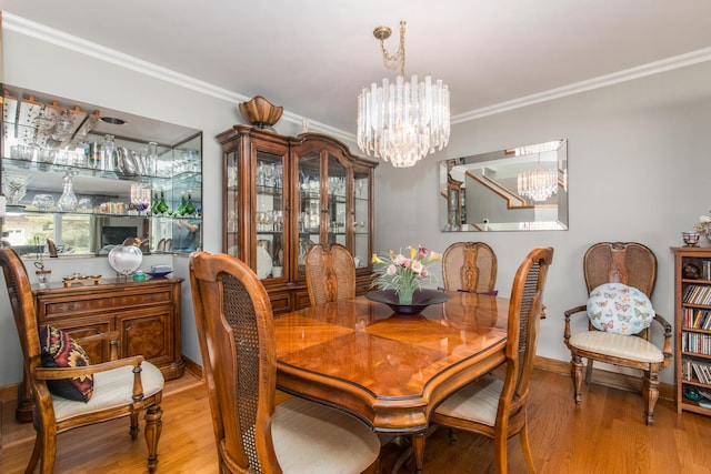 228 Cornell Ave, Des Plaines, IL 60016 - dining room with a chandelier, wood finished floors, crown molding, a bar, and baseboards
