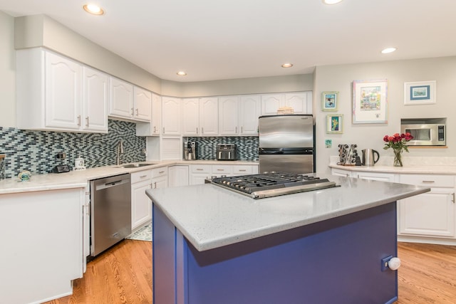 228 Cornell Ave, Des Plaines, IL 60016 - kitchen featuring stainless steel appliances, a sink, light wood-style floors, white cabinetry, and recessed lighting