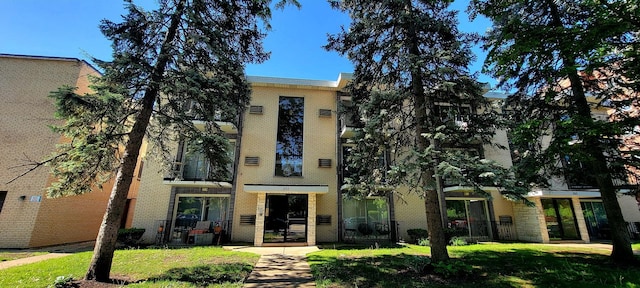 1353 Perry St Unit 6, Des Plaines, IL 60016 - view of front of house with a front lawn and brick siding