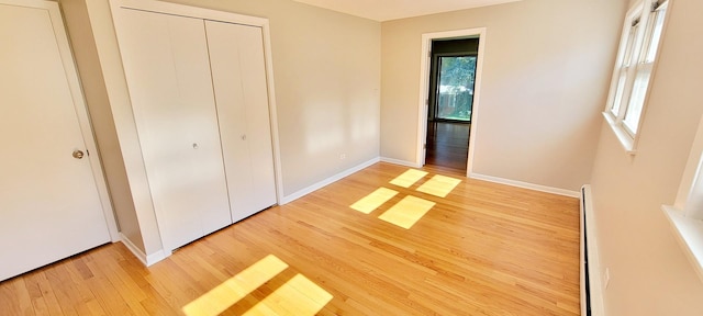 1353 Perry St Unit 6, Des Plaines, IL 60016 - unfurnished bedroom featuring light wood-style flooring, baseboards, and a closet