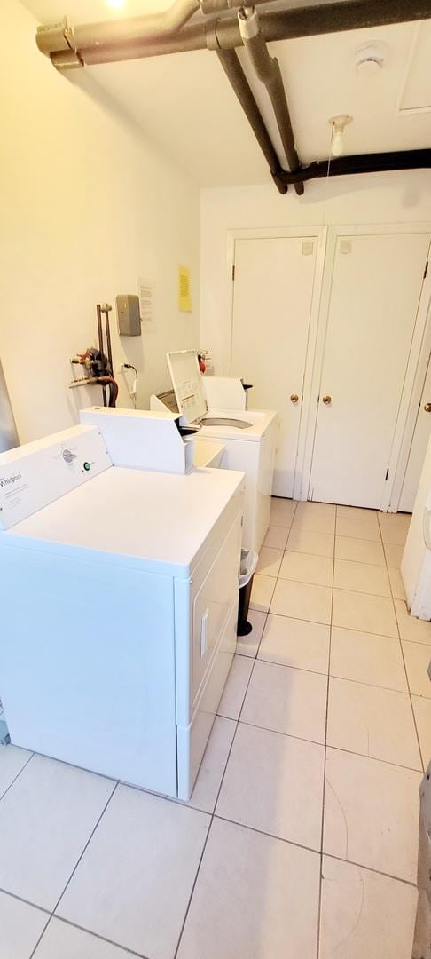 1353 Perry St Unit 6, Des Plaines, IL 60016 - shared laundry room featuring separate washer and dryer and light tile patterned floors