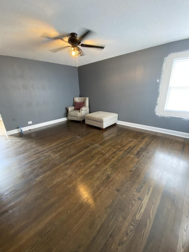 16133 Cambridge Dr, Markham, IL 60428 - unfurnished room with dark wood-type flooring, a ceiling fan, baseboards, and a textured ceiling
