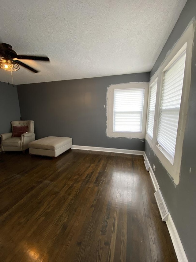 16133 Cambridge Dr, Markham, IL 60428 - unfurnished room featuring dark wood-style flooring, a textured ceiling, baseboards, and a ceiling fan