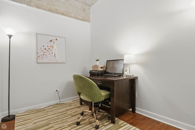 1111 W 14th Pl Unit 211, Chicago, IL 60608 - home office with baseboards and wood finished floors