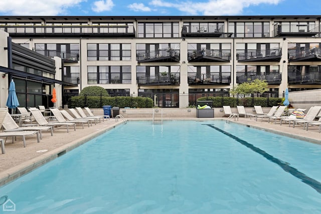 1111 W 14th Pl Unit 211, Chicago, IL 60608 - community pool featuring a patio