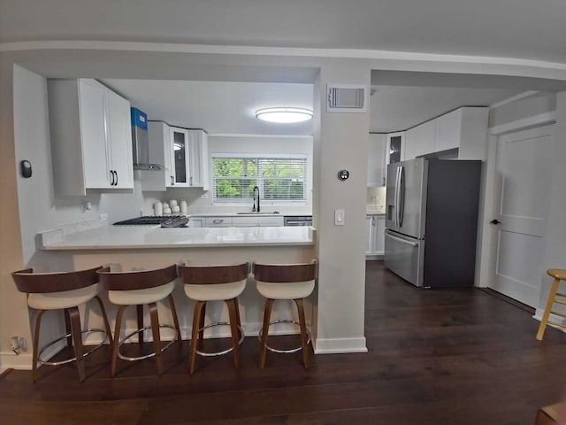 1762 W Palatine Rd, Inverness, IL 60067 - kitchen with stainless steel fridge, a sink, glass insert cabinets, a kitchen bar, and white cabinets