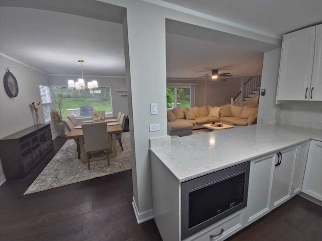 1762 W Palatine Rd, Inverness, IL 60067 - kitchen with white cabinets, light stone counters, a chandelier, open floor plan, and dark wood-style flooring