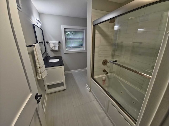 1762 W Palatine Rd, Inverness, IL 60067 - full bathroom featuring vanity, a combined bath / shower with jetted tub, and baseboards