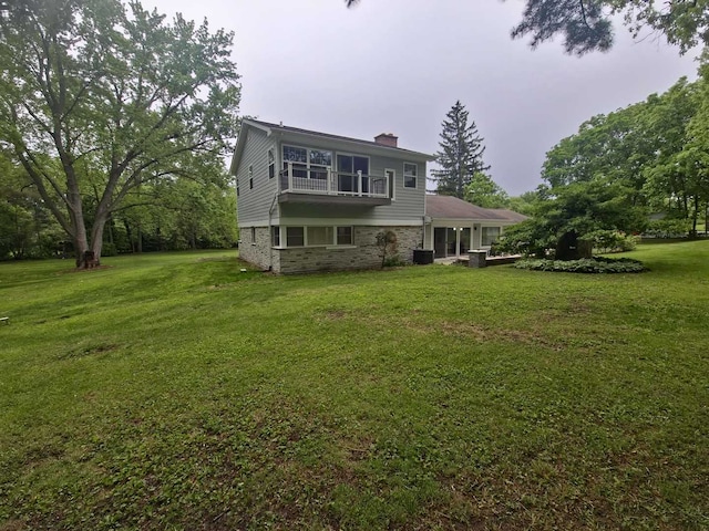1762 W Palatine Rd, Inverness, IL 60067 - back of property featuring a chimney, a yard, a balcony, and cooling unit