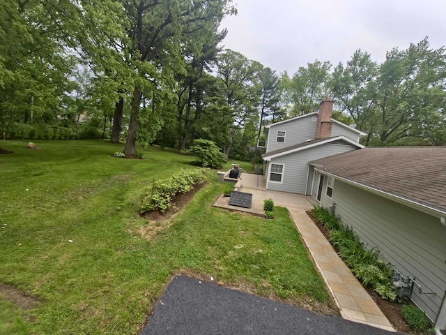 1762 W Palatine Rd, Inverness, IL 60067 - view of grassy yard featuring view of wooded area and a patio