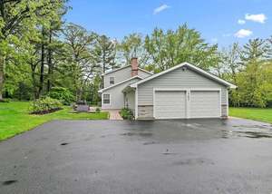 1762 W Palatine Rd, Inverness, IL 60067 - view of front facade featuring asphalt driveway and an attached garage