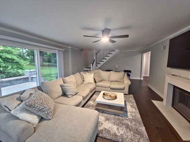 1762 W Palatine Rd, Inverness, IL 60067 - living room featuring stairway, wood finished floors, a fireplace with flush hearth, ceiling fan, and baseboards