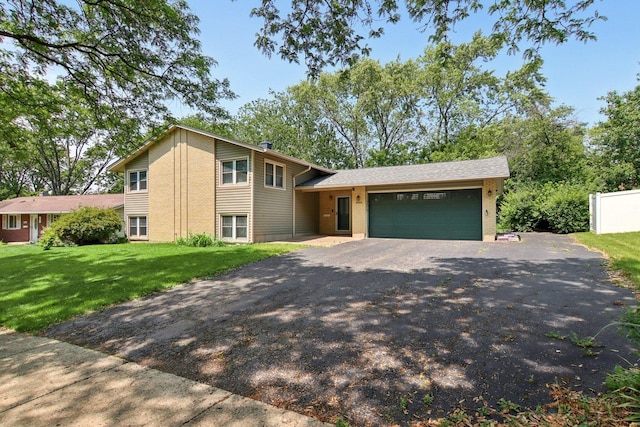 6100 Ridgeway Dr, Woodridge, IL 60517 - tri-level home with an attached garage, driveway, a front lawn, and brick siding