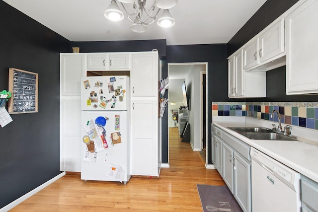 6100 Ridgeway Dr, Woodridge, IL 60517 - kitchen with white appliances, light countertops, white cabinets, and backsplash
