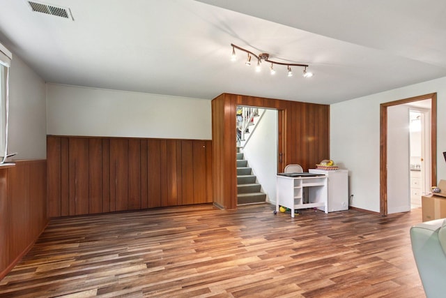 6100 Ridgeway Dr, Woodridge, IL 60517 - living area with wood walls, stairs, and wood finished floors