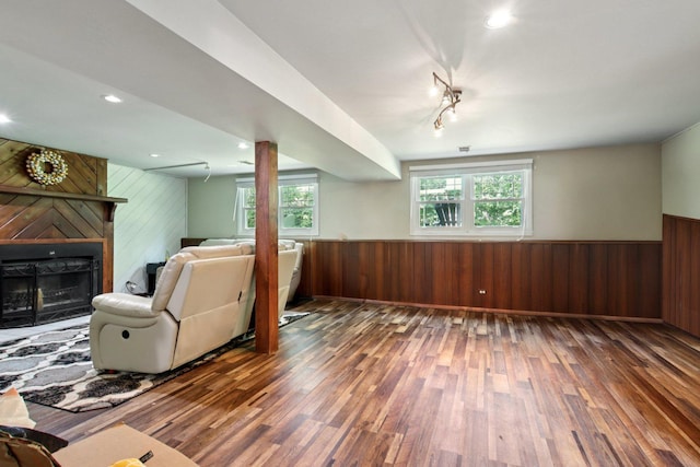 6100 Ridgeway Dr, Woodridge, IL 60517 - living area featuring wood walls, hardwood / wood-style floors, a wainscoted wall, a large fireplace, and recessed lighting