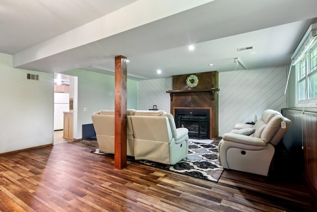 6100 Ridgeway Dr, Woodridge, IL 60517 - living room with wood finished floors, a large fireplace, and wood walls