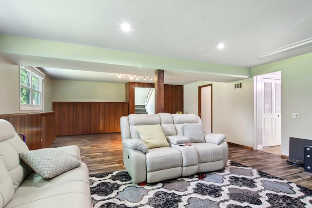 6100 Ridgeway Dr, Woodridge, IL 60517 - living room featuring wood finished floors, stairs, wooden walls, and recessed lighting