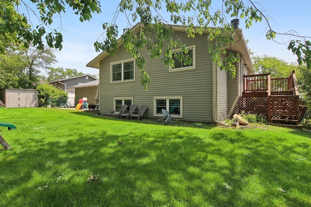 6100 Ridgeway Dr, Woodridge, IL 60517 - rear view of property with a deck, a lawn, and a shed