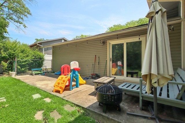 6100 Ridgeway Dr, Woodridge, IL 60517 - view of patio featuring a fire pit