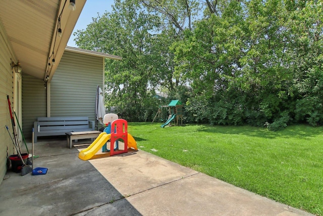 6100 Ridgeway Dr, Woodridge, IL 60517 - view of green lawn with a playground and a patio area