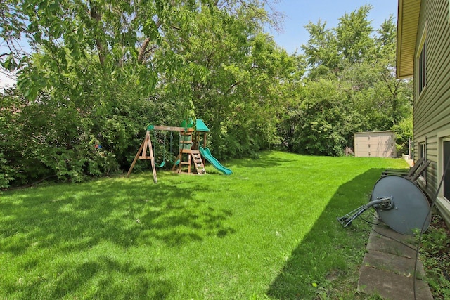 6100 Ridgeway Dr, Woodridge, IL 60517 - view of green lawn featuring a playground