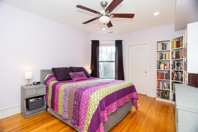 1239 W Jarvis Ave Unit 3, Chicago, IL 60626 - bedroom with light wood-style flooring, recessed lighting, ceiling fan, and baseboards
