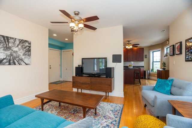 1239 W Jarvis Ave Unit 3, Chicago, IL 60626 - living area with a ceiling fan, light wood-type flooring, recessed lighting, and baseboards