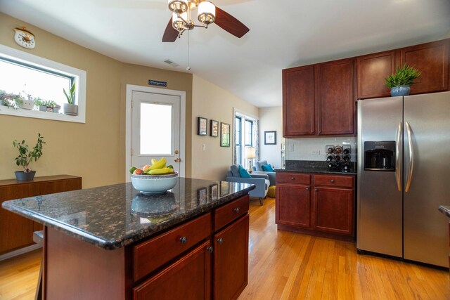 1239 W Jarvis Ave Unit 3, Chicago, IL 60626 - kitchen with stainless steel fridge, a ceiling fan, plenty of natural light, and light wood-type flooring