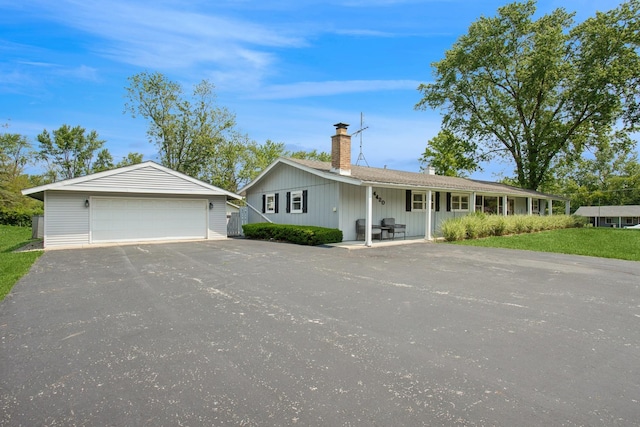 4420 185th Pl, Country Club Hills, IL 60478 - single story home with a chimney, a garage, a porch, and an outdoor structure