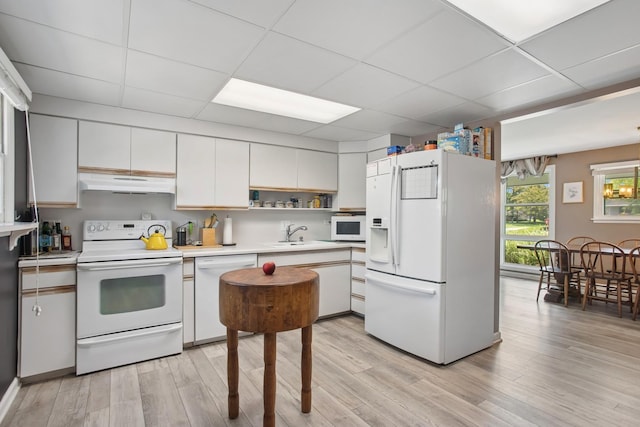 4420 185th Pl, Country Club Hills, IL 60478 - kitchen with white appliances, under cabinet range hood, a sink, light countertops, and a paneled ceiling