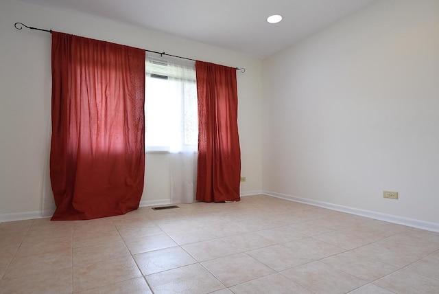 50 Ridgewood Rd, Elk Grove Village, IL 60007 - empty room with light tile patterned floors and baseboards