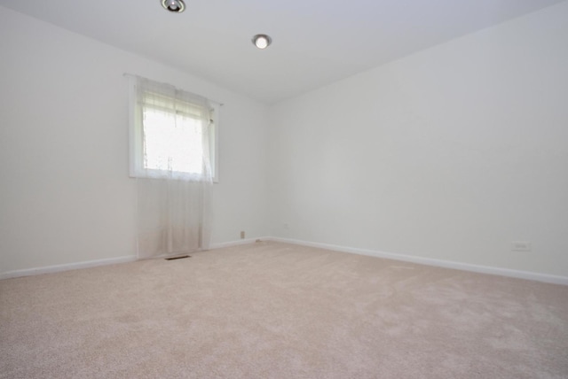 50 Ridgewood Rd, Elk Grove Village, IL 60007 - unfurnished room featuring light carpet and baseboards