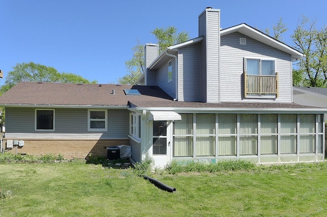 50 Ridgewood Rd, Elk Grove Village, IL 60007 - rear view of property with a chimney, a yard, cooling unit, and brick siding