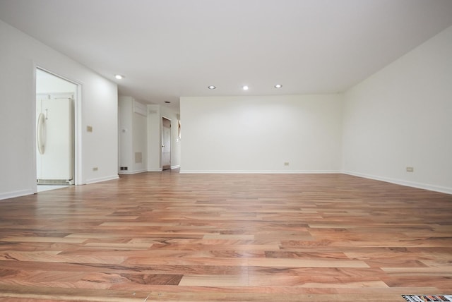 50 Ridgewood Rd, Elk Grove Village, IL 60007 - empty room with light wood finished floors, recessed lighting, and baseboards