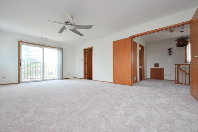 50 Ridgewood Rd, Elk Grove Village, IL 60007 - unfurnished living room with ceiling fan, light carpet, and baseboards