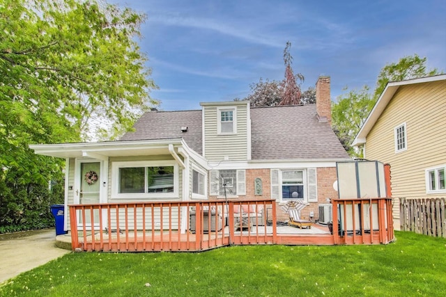 300 Hollywood Ct, Wilmette, IL 60091 - back of house with a chimney, roof with shingles, a deck, central air condition unit, and brick siding