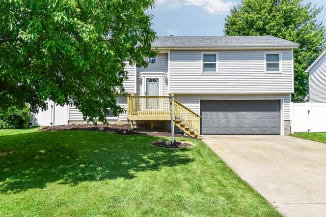 1403 N Motorola Dr, Pontiac, IL 61764 - bi-level home featuring a garage and concrete driveway