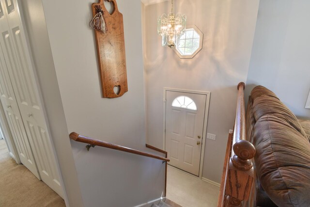 1403 N Motorola Dr, Pontiac, IL 61764 - foyer entrance featuring light carpet, a chandelier, and baseboards