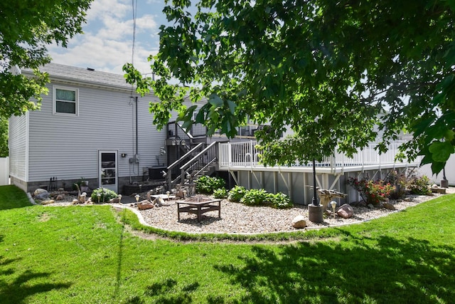 1403 N Motorola Dr, Pontiac, IL 61764 - back of property featuring an outdoor fire pit, a yard, a deck, and stairs