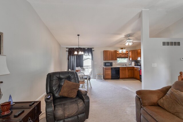 1403 N Motorola Dr, Pontiac, IL 61764 - living area featuring light carpet, a chandelier, and ceiling fan