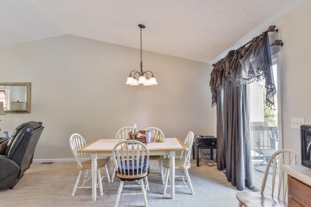 1403 N Motorola Dr, Pontiac, IL 61764 - dining area with vaulted ceiling, a chandelier, light carpet, and baseboards