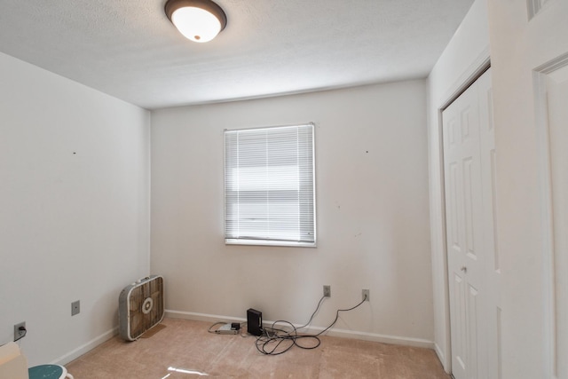 1403 N Motorola Dr, Pontiac, IL 61764 - unfurnished bedroom featuring a closet, carpet flooring, and baseboards