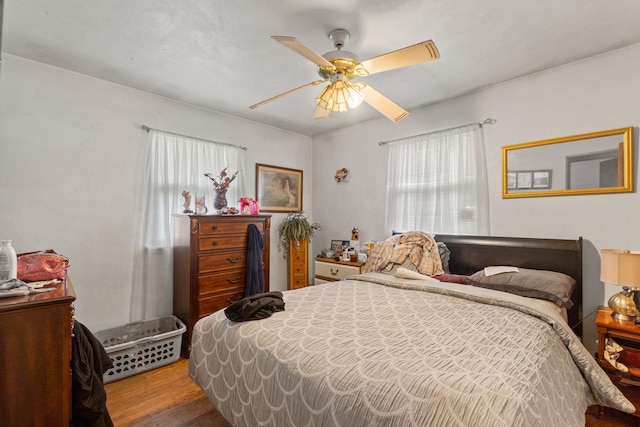 1311 Black Rd, Joliet, IL 60435 - bedroom with wood finished floors and a ceiling fan