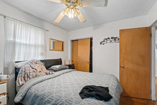 1311 Black Rd, Joliet, IL 60435 - bedroom with wood finished floors and a ceiling fan