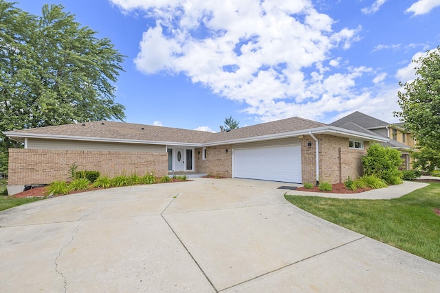 9836 Circle Pkwy, Palos Park, IL 60464 - ranch-style house with brick siding, concrete driveway, and an attached garage