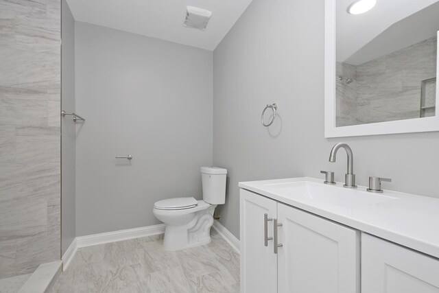 9836 Circle Pkwy, Palos Park, IL 60464 - full bath featuring vanity, toilet, tiled shower, marble finish flooring, and baseboards