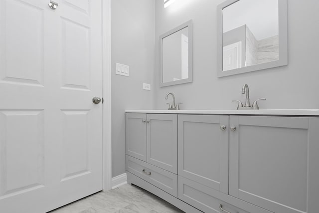 9836 Circle Pkwy, Palos Park, IL 60464 - full bath with marble look tiles, double vanity, and baseboards