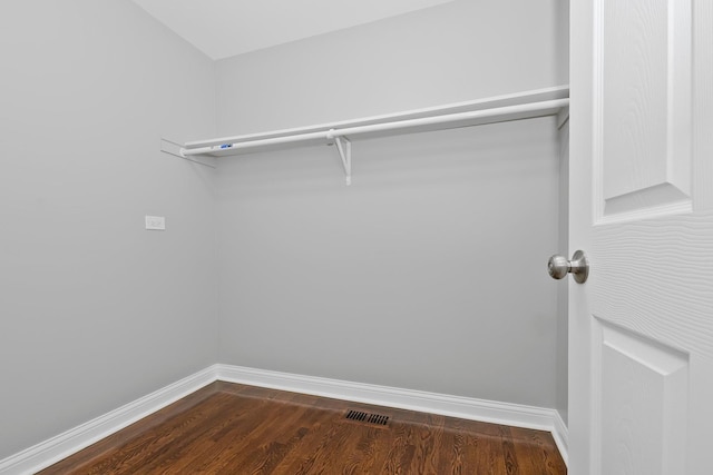 9836 Circle Pkwy, Palos Park, IL 60464 - walk in closet with dark wood-style floors